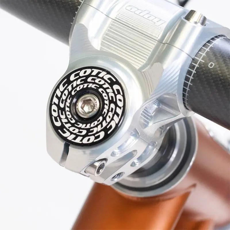 Headset Top Cap - Rotating Concentric Cotic style - black with white logos